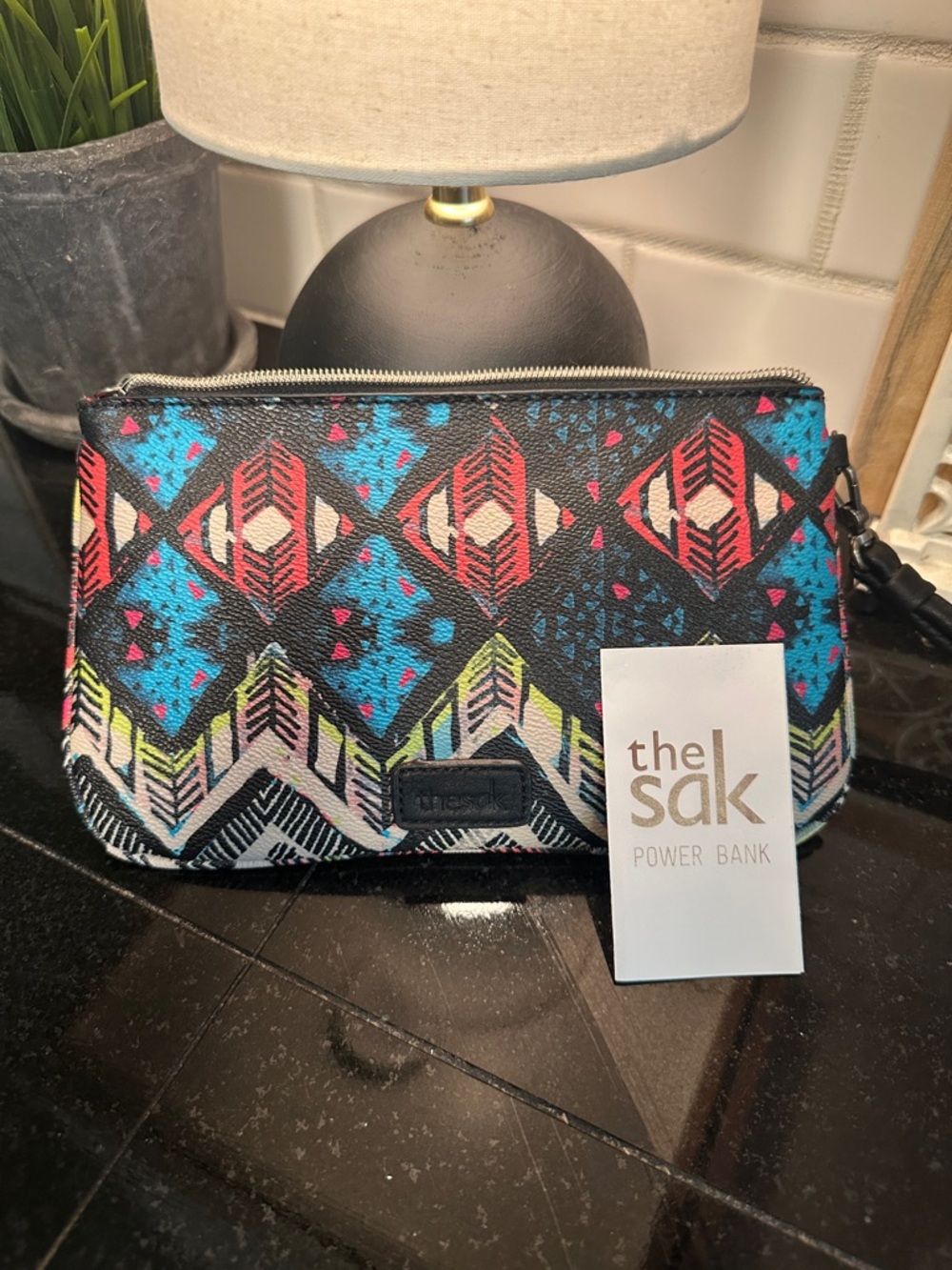 The Sak Black Aztec-Print Wristlet Clutch with Multicolor Accents and power bank